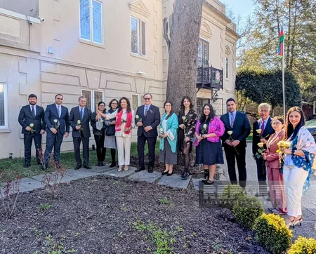 White rose planted at Azerbaijan Embassy using shovel made from mine debris