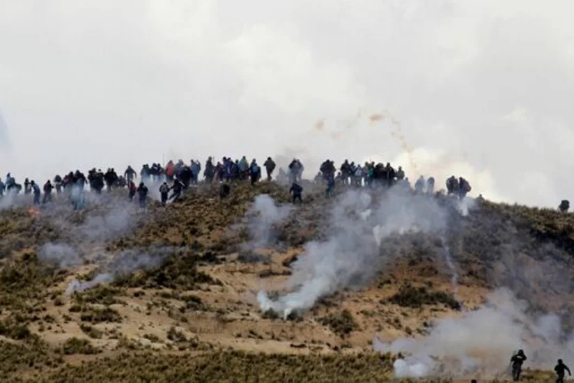 Bolivian miners clash with police in La Paz, demand president's resignation