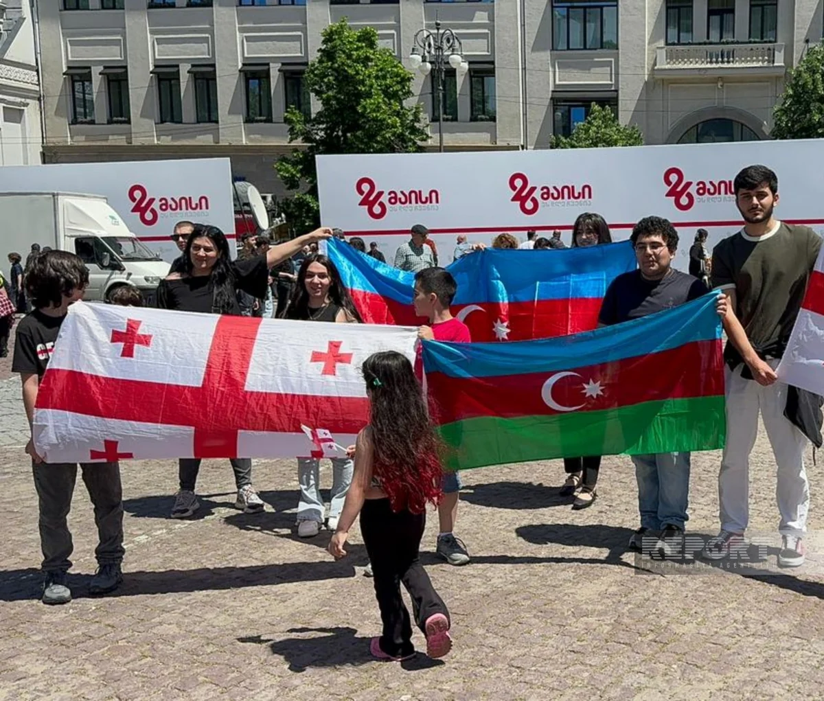 Azerbaijanis march with flags at Georgia's Independence Day celebration in Tbilisi