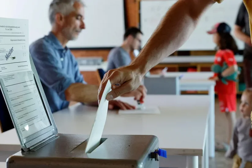 Swiss voters set to reject population cap in referendum, avoiding EU clash