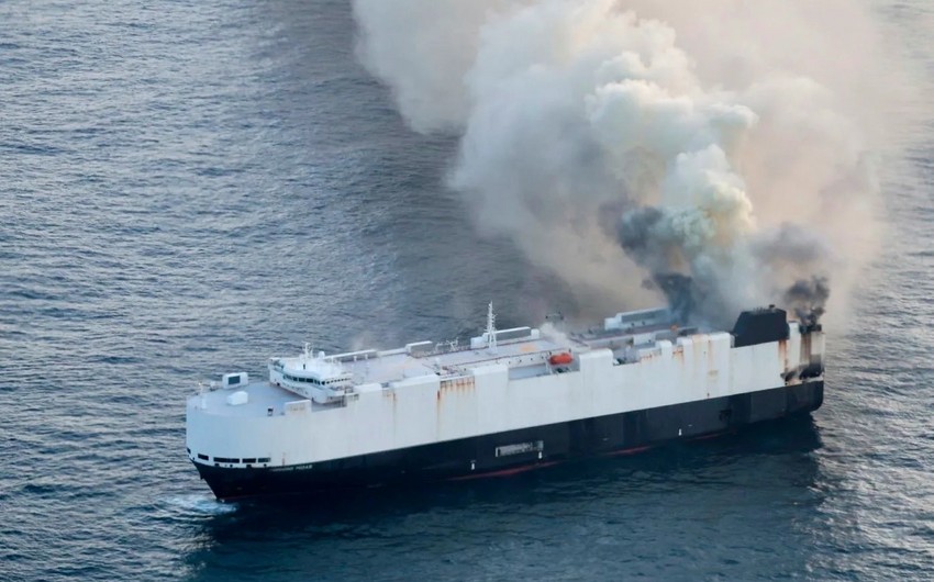 Ship carrying EVs abandoned in Pacific after catching fire