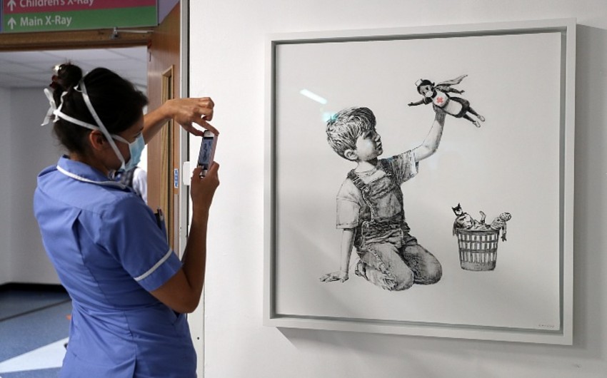 Banksy to auction painting drawn in hospital
