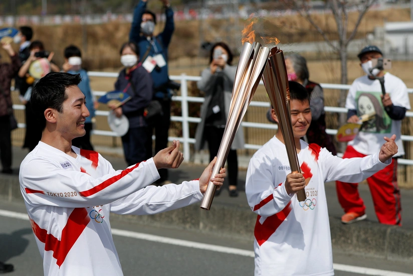 Tokyo Olympic torch relay starts in Japan amid pandemic curbs