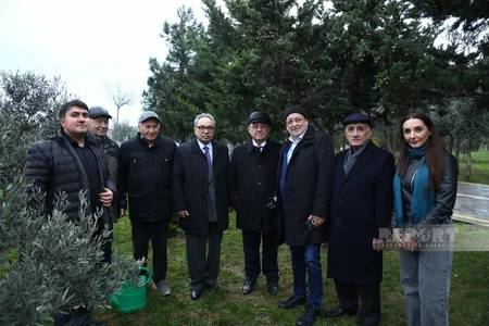 International conference participants in Baku plant trees in Zira Ecopark