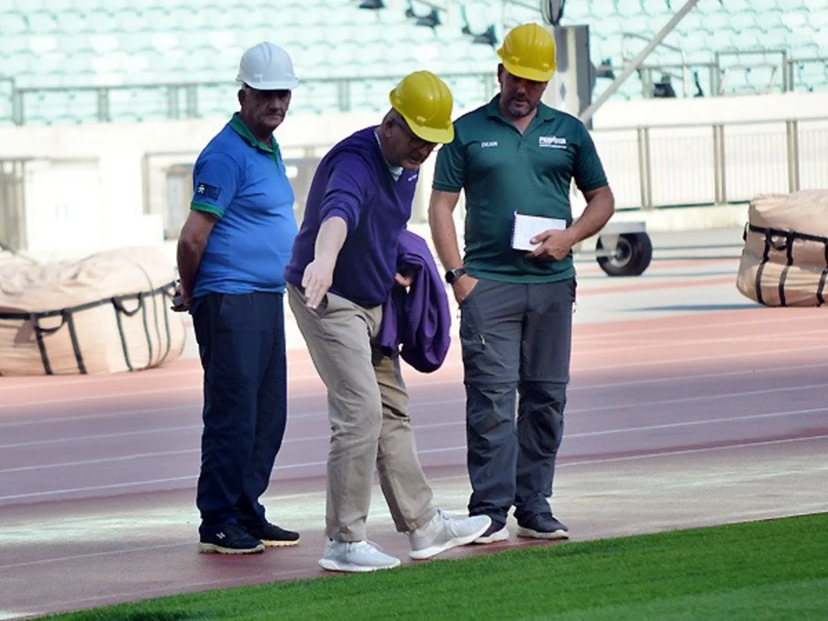 UEFA representatives view grass cover at Baku Olympic Stadium