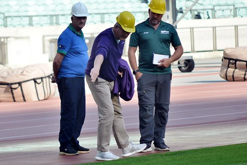 UEFA representatives view grass cover at Baku Olympic Stadium