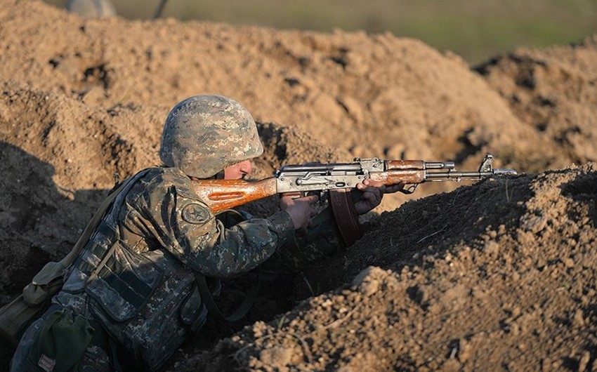 Armenians use sniper rifles to fire at Azerbaijani positions