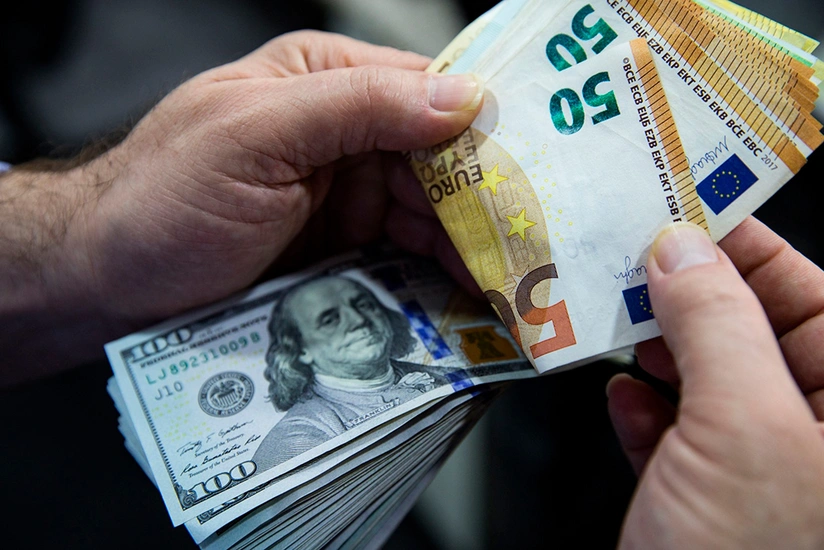 Euro tops dollar as payments currency for first time since 2013