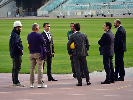 UEFA representatives view grass cover at Baku Olympic Stadium