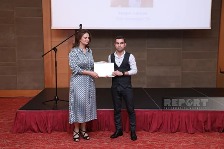 Dövlət Komitəsi Reportun əməkdaşını mükafatlandırıb