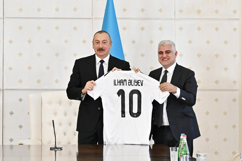 Ilham Aliyev presented with uniform of Qarabag FK
