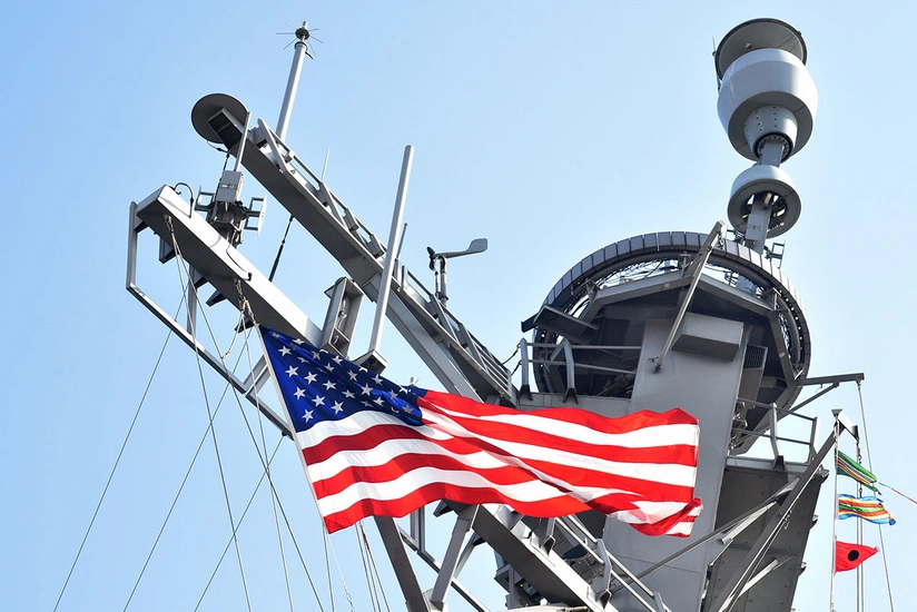 US Navy ship fires warning shots near Iranian vessels