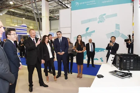 President Ilham Aliyev views Bakutel 2018 exhibition