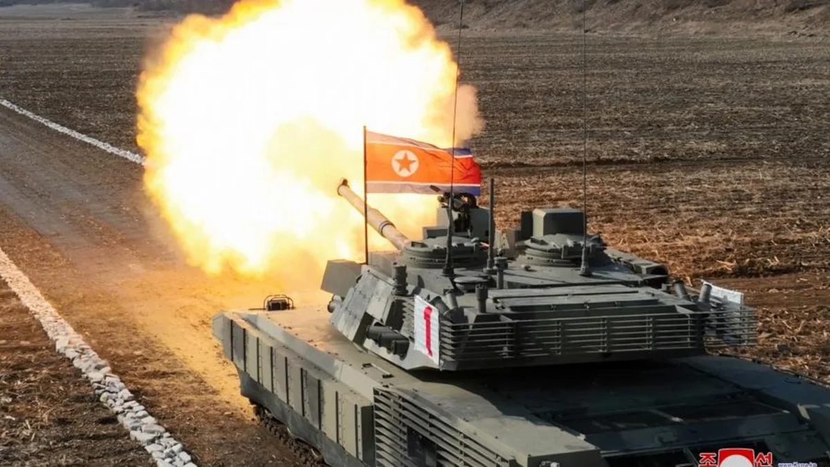 North Korea's Kim 'drives' new tank during mock battle