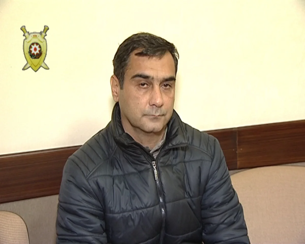 Bakıda banka basqın edən şəxsin və onu tutan polisin fotoları yayılıb