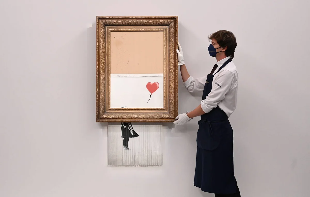 Banksy’s shredding artwork auctioned for $25.4M