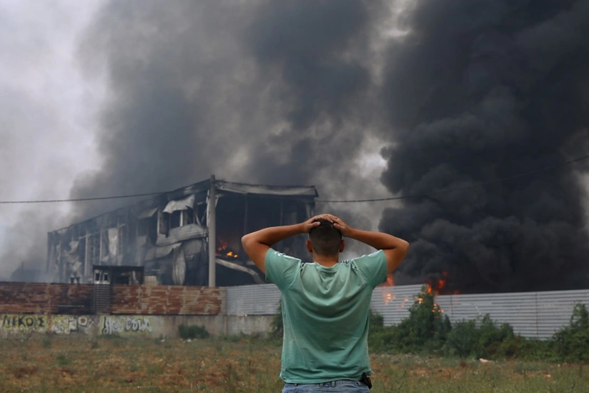 Death toll rises as wildfires rage across Greece