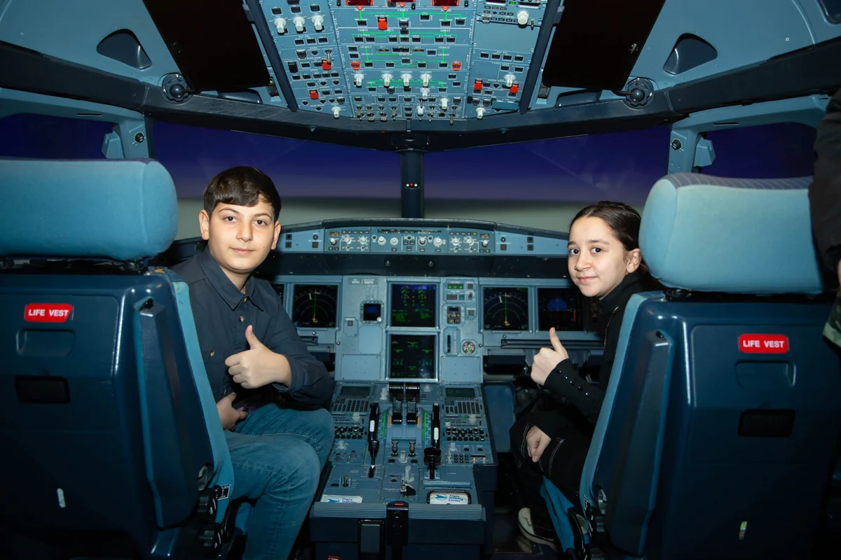 Martyrs' children visit Flight Training Center