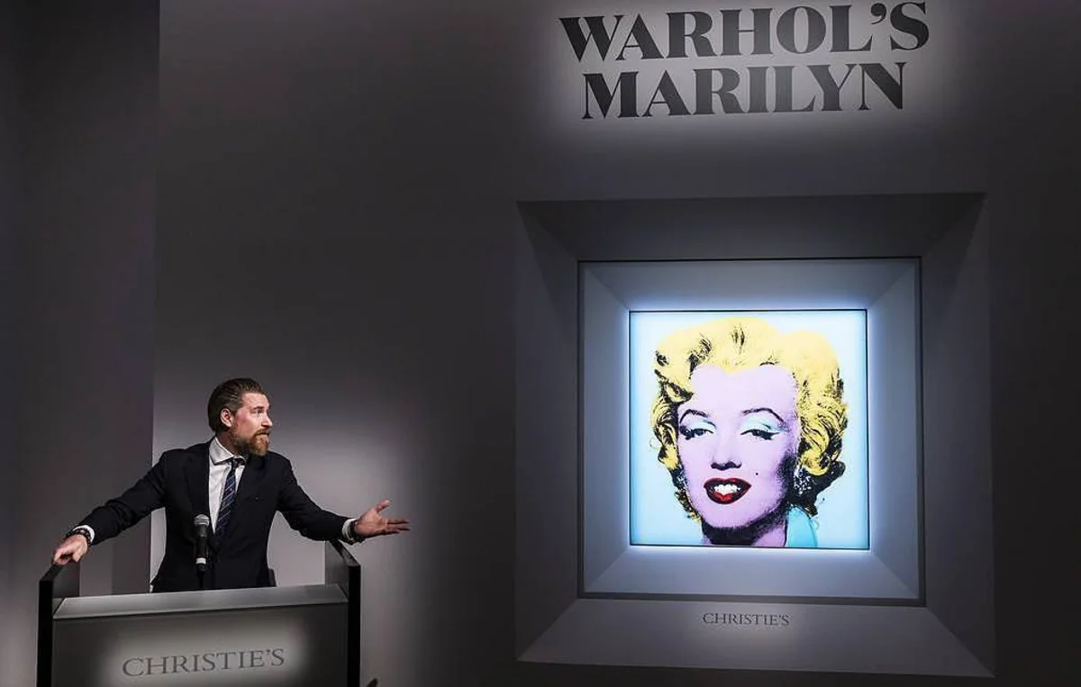 Warhol’s famed Marilyn Monroe portrait sells for record price at auction