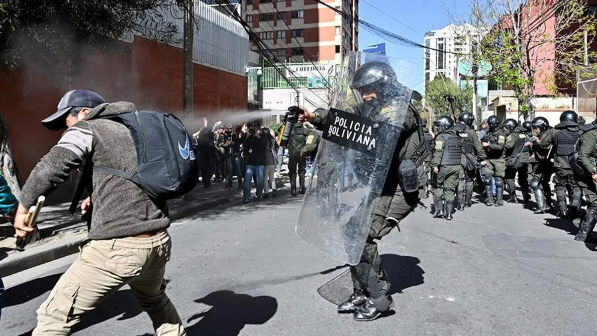 Bolivia police fire tear gas on Morales supporters protesting electoral ban