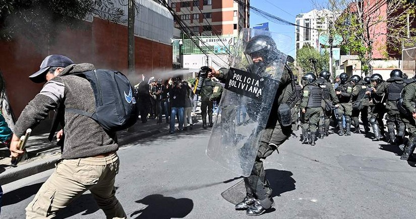 Bolivia police fire tear gas on Morales supporters protesting electoral ban