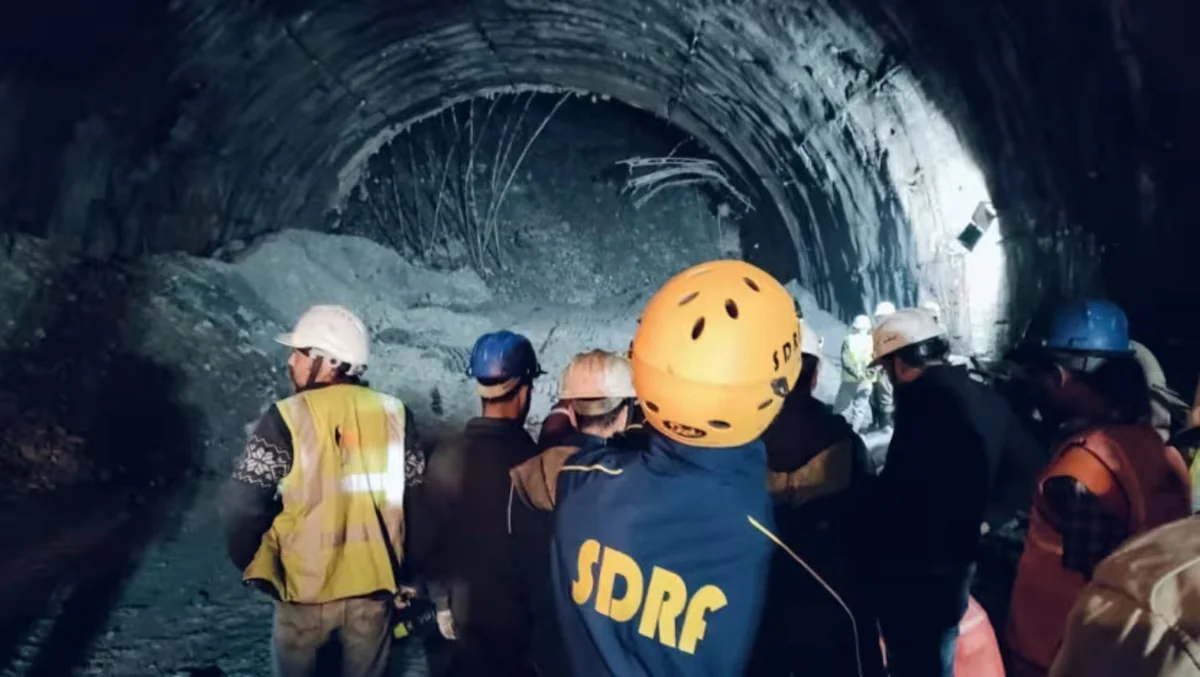 Rescuers scramble to reach up to 40 workers trapped in Himalayan tunnel collapse