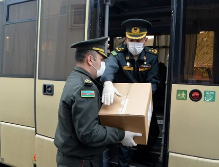 Azerbaijani servicemen deliver assistance to martyrs' families - VIDEO
