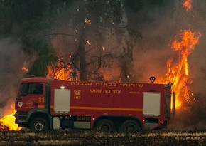 Fire service says over 150 firefighting teams still working to extinguish blazes in Israel