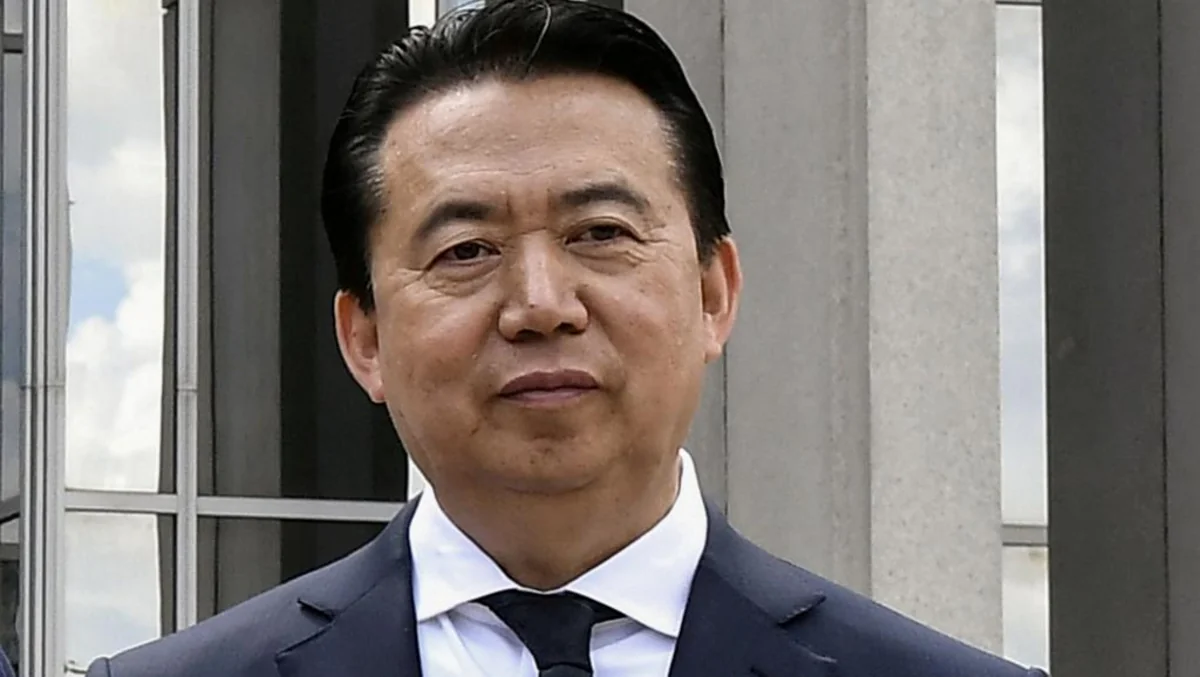 Former Interpol head sentenced to 13.5 years in prison in China