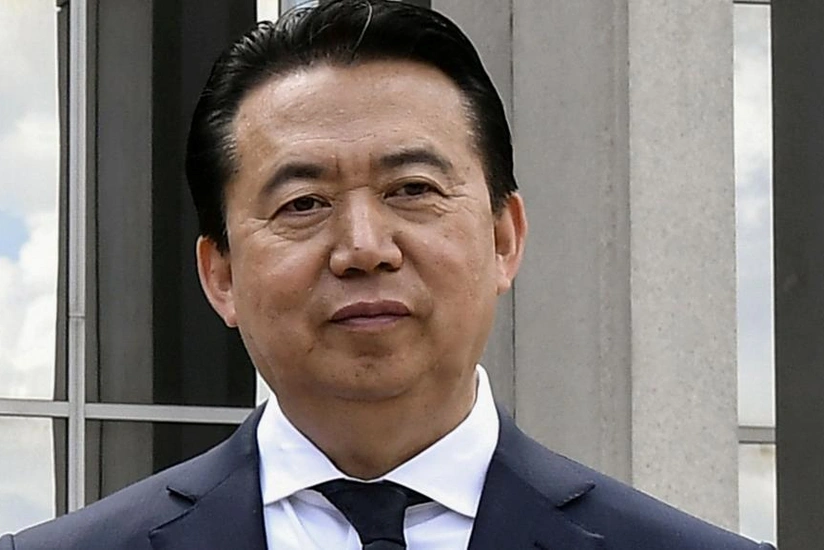 Former Interpol head sentenced to 13.5 years in prison in China