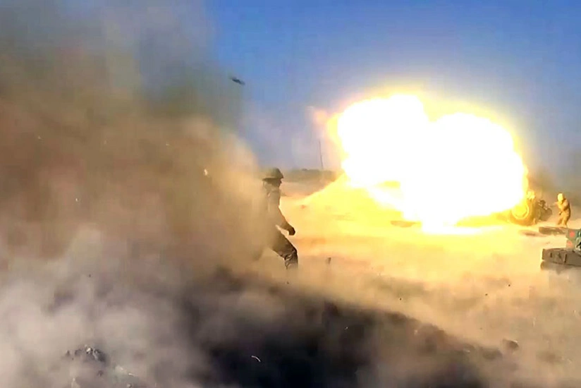 Launching rocket and artillery strikes against enemy positions