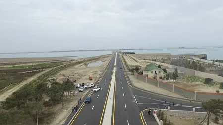President Ilham Aliyev inaugurates a new bridge in Pirallahi settlement