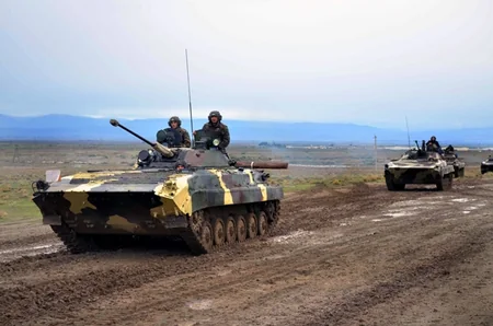 Armored vehicles battle shooting exercises started in frontline zone