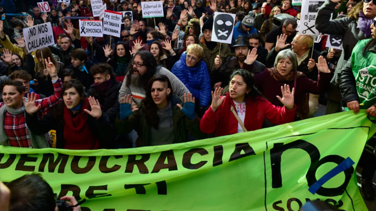 Rallies staged in over 30 Spanish cities against tough new anti-protest law