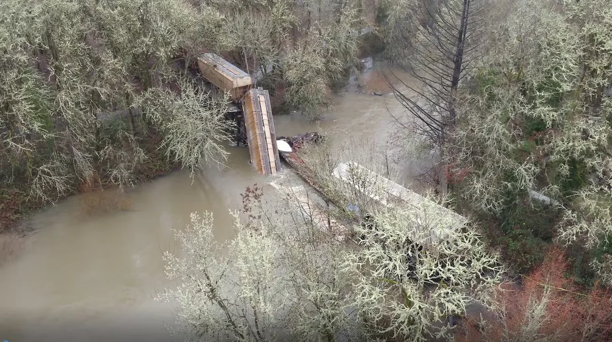US railroad bridge collapses under train, railcar crashes into river