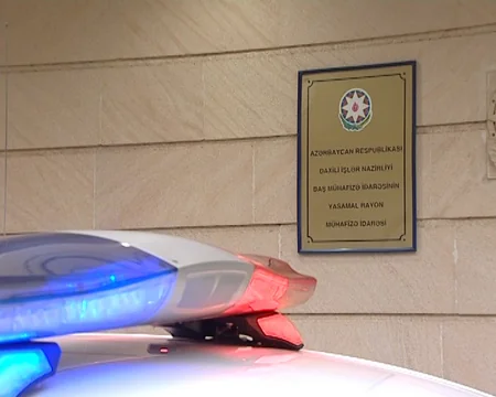 Bakıda banka basqın edən şəxsin və onu tutan polisin fotoları yayılıb