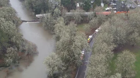 US railroad bridge collapses under train, railcar crashes into river