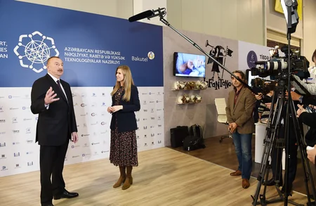 President Ilham Aliyev views Bakutel 2018 exhibition