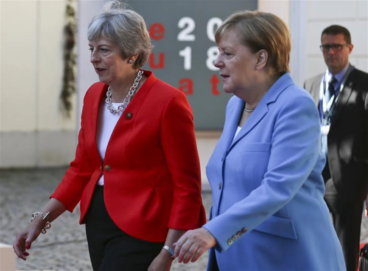 Angela Merkel refuses to shake hands with Theresa May