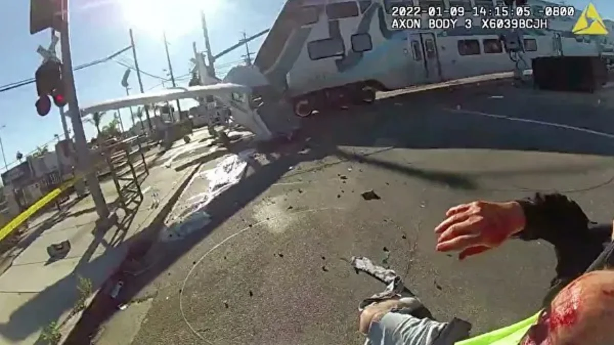 Pilot rescued seconds before train smashes crashed plane