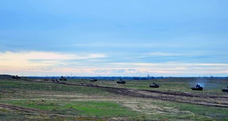 Armored vehicles battle shooting exercises started in frontline zone