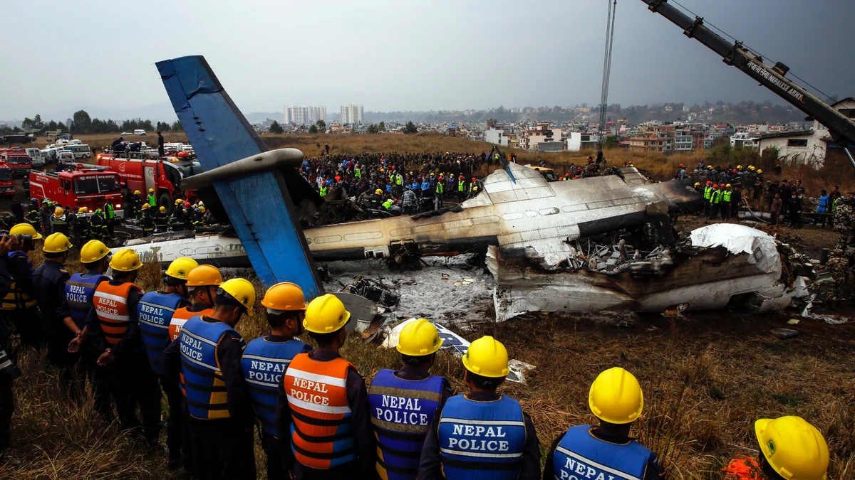 Plane slips off runway and crashes in Nepal, killing 18 people