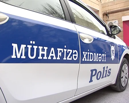 Bakıda banka basqın edən şəxsin və onu tutan polisin fotoları yayılıb