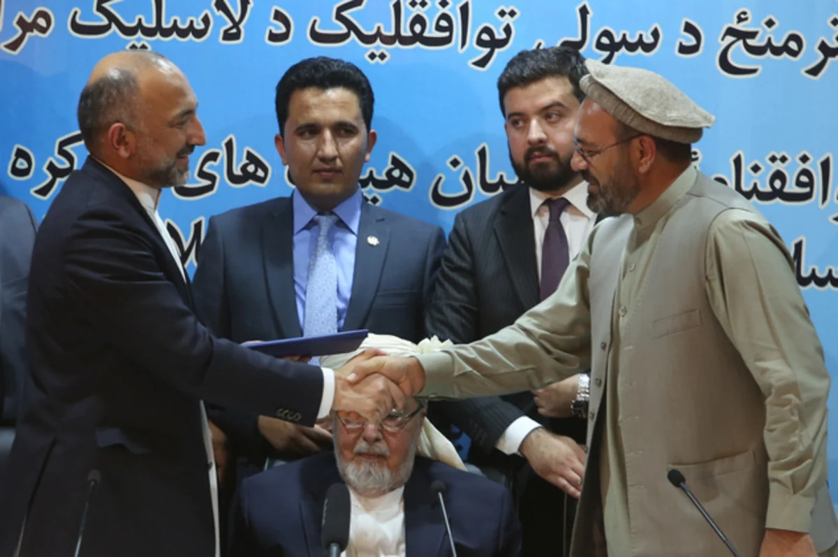 Afghan president signs peace deal with armed opposition