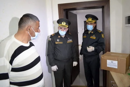 Azerbaijani servicemen deliver assistance to martyrs' families - VIDEO