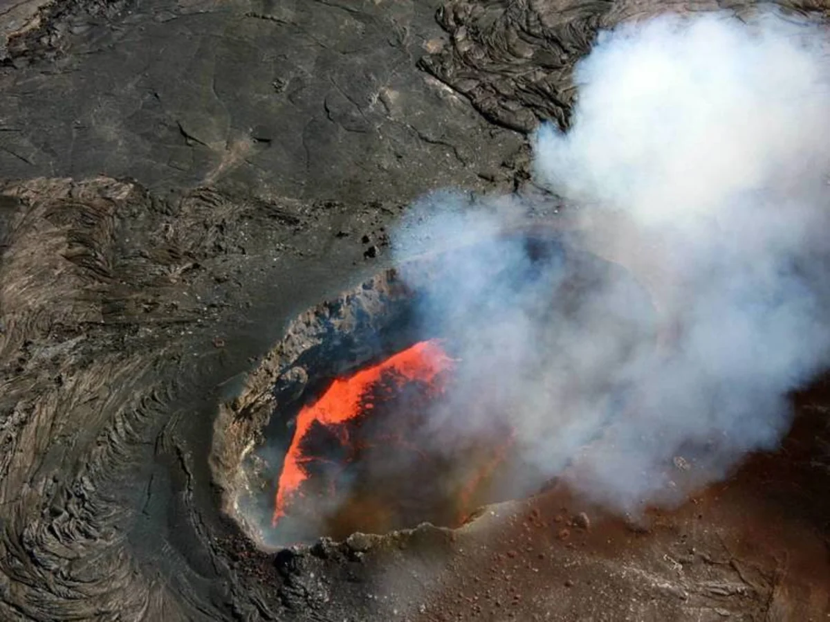 Italy's Mount Etna spews out lava and clouds of ash