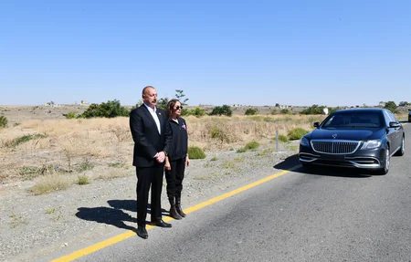 Ilham Aliyev and Mehriban Aliyeva visit memorial plaque dedicated to Remembrance Day in Qarakhanbayli