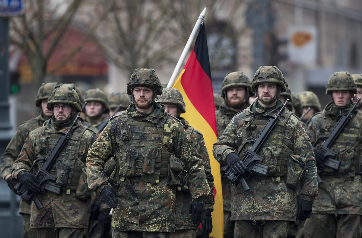 German defense minister says Berlin should increase military spending