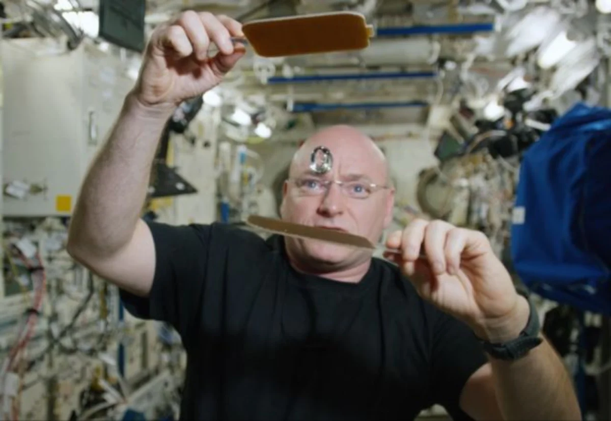 Astronaut uses special paddles to play in gravity with a floating ball of water - VIDEO