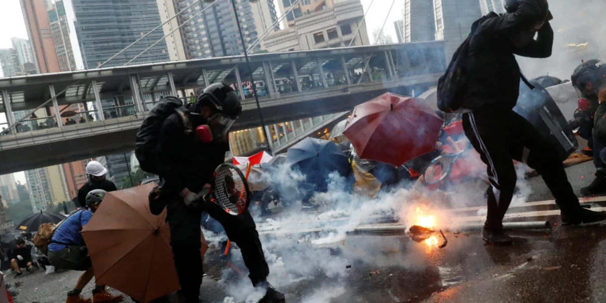 Hong Kong: Tear gas fired as protesters defy police